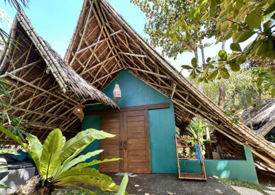 Garden view cottage with traditional Filipino bamboo and nipah roof.