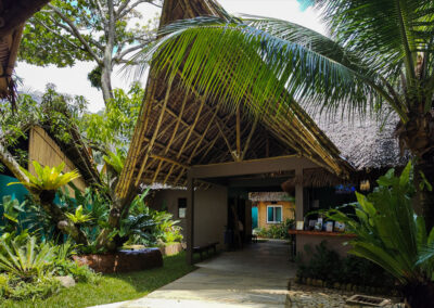 The entrance to Buko Beach Resort built in traditional Filipino style using bamboo and nipah.