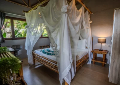 Loft Studio bedroom king-sized bed with mosquito net, work desk and wardrobe