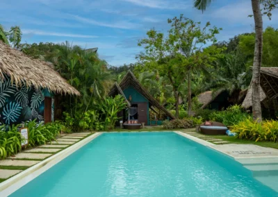 View from the beach of swimming pool and cottage